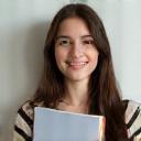 Photo of student Sophia M. with a book.